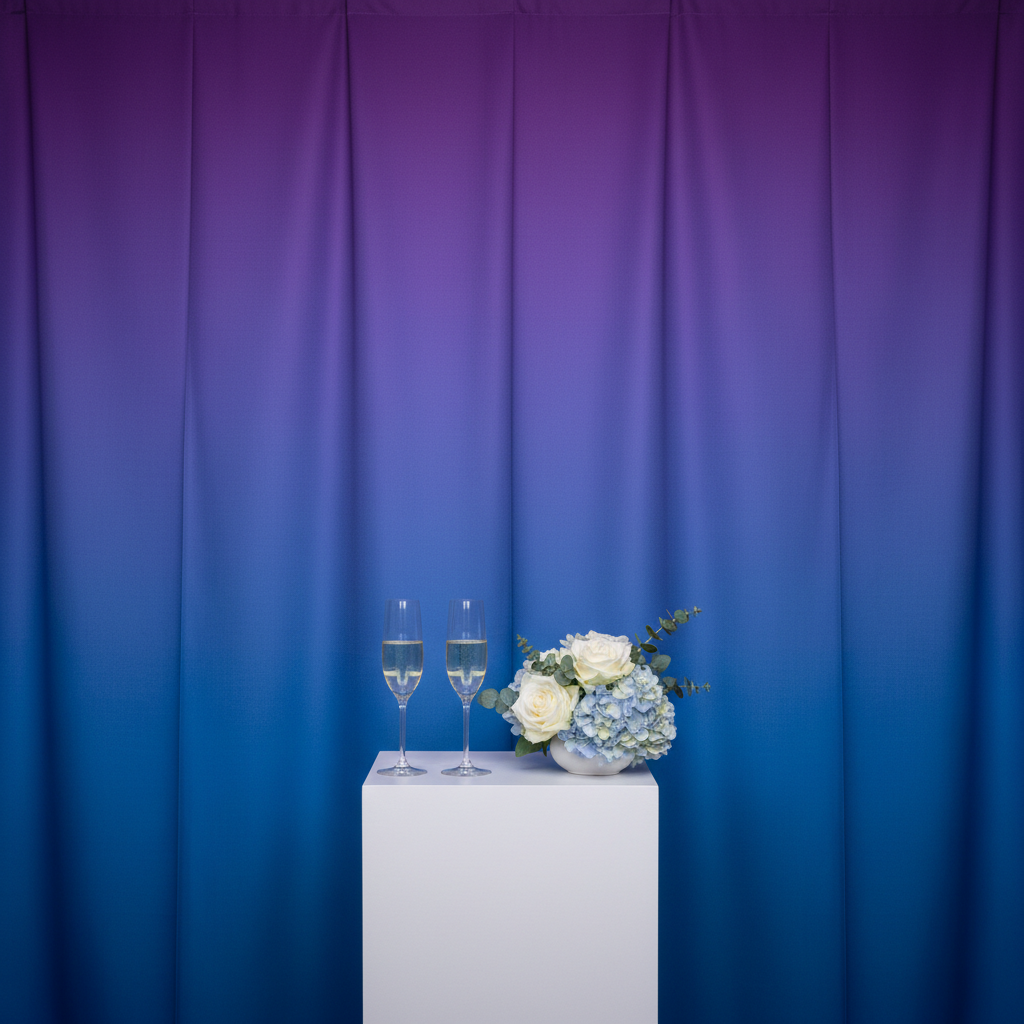 A vibrant event backdrop made of high-quality fabric, with soft lighting and a blurred background of happy event-goers. The backdrop shows a gradient of blue and pink, showcasing the best backdrop materials for events.